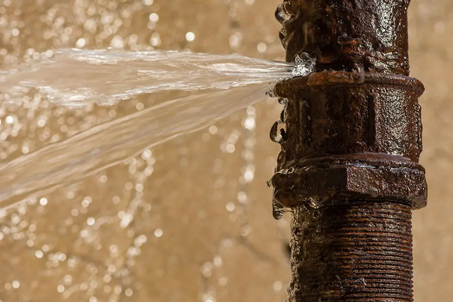 Rusty pipe leaking water